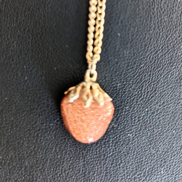 A Sunstone pendant on a Gold toned chain 19” inches. - Picture 2 of 5